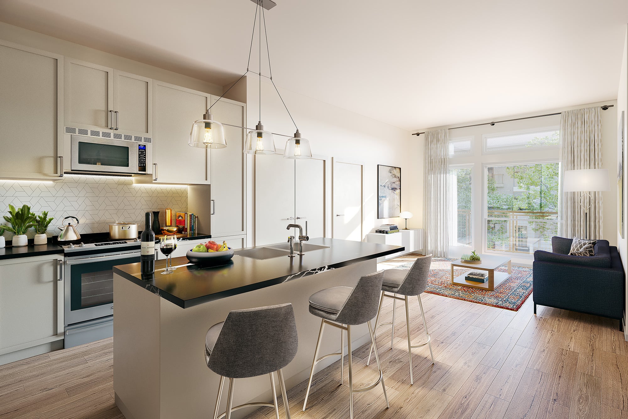 Model living room at our senior living apartments in Austin, TX, featuring wood grain flooring and a kitchen island.